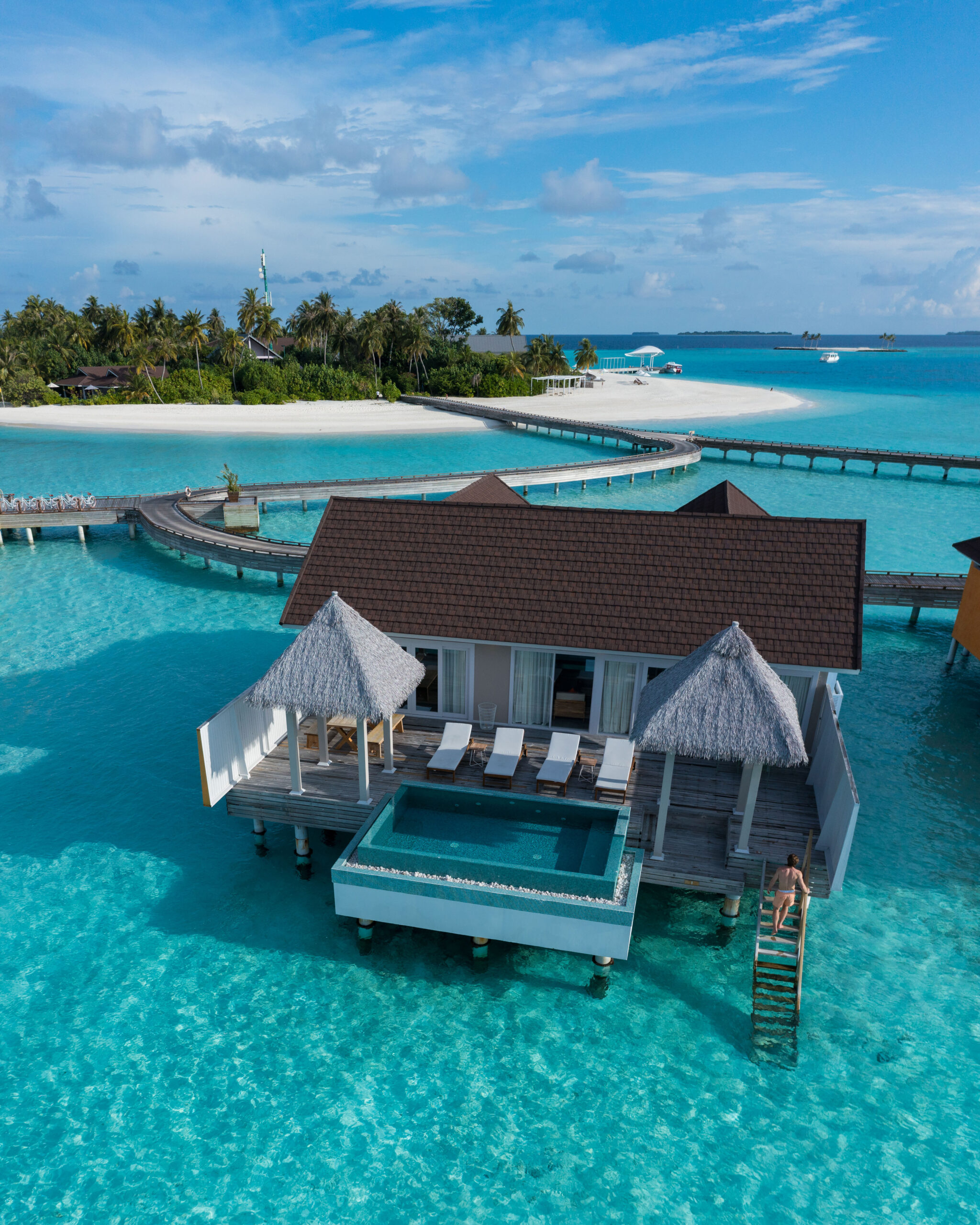 Maldives resort with overwater villas and tropical island